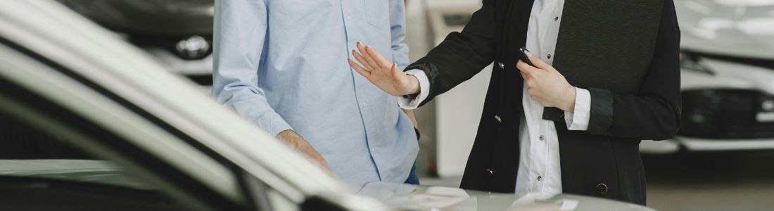 People looking to buy car at the dealership