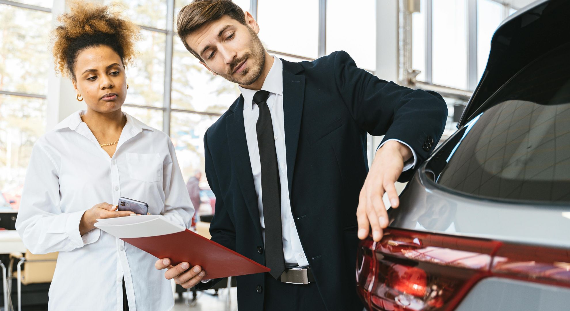 Car salesman and customer