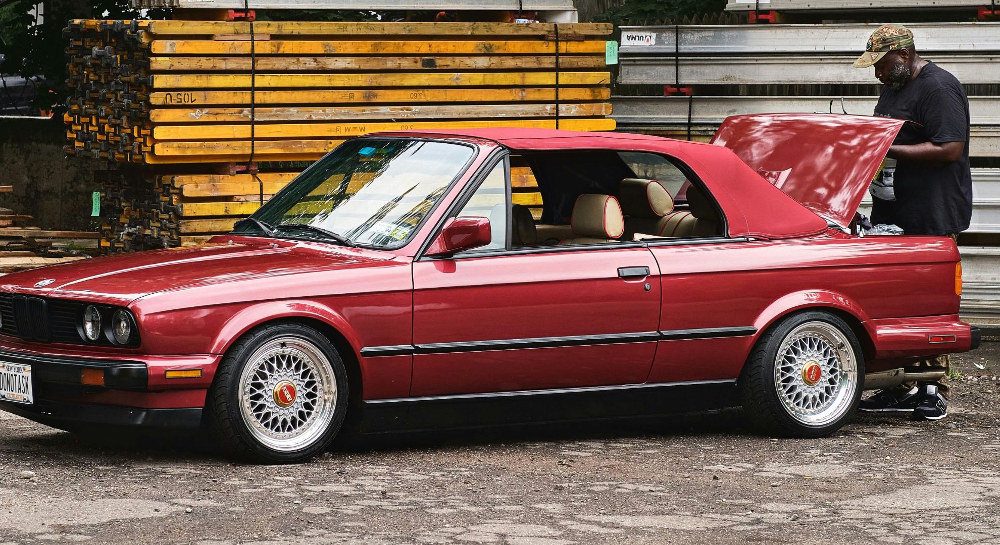 Man repairing BMW