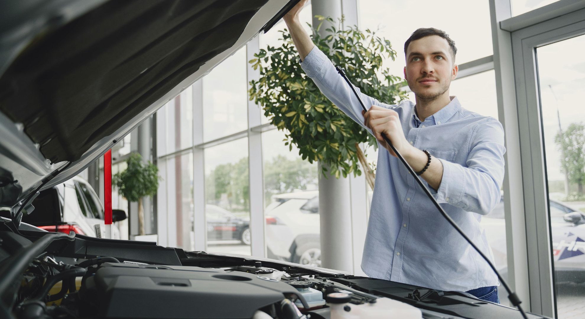 Checking under the hood at the dealership