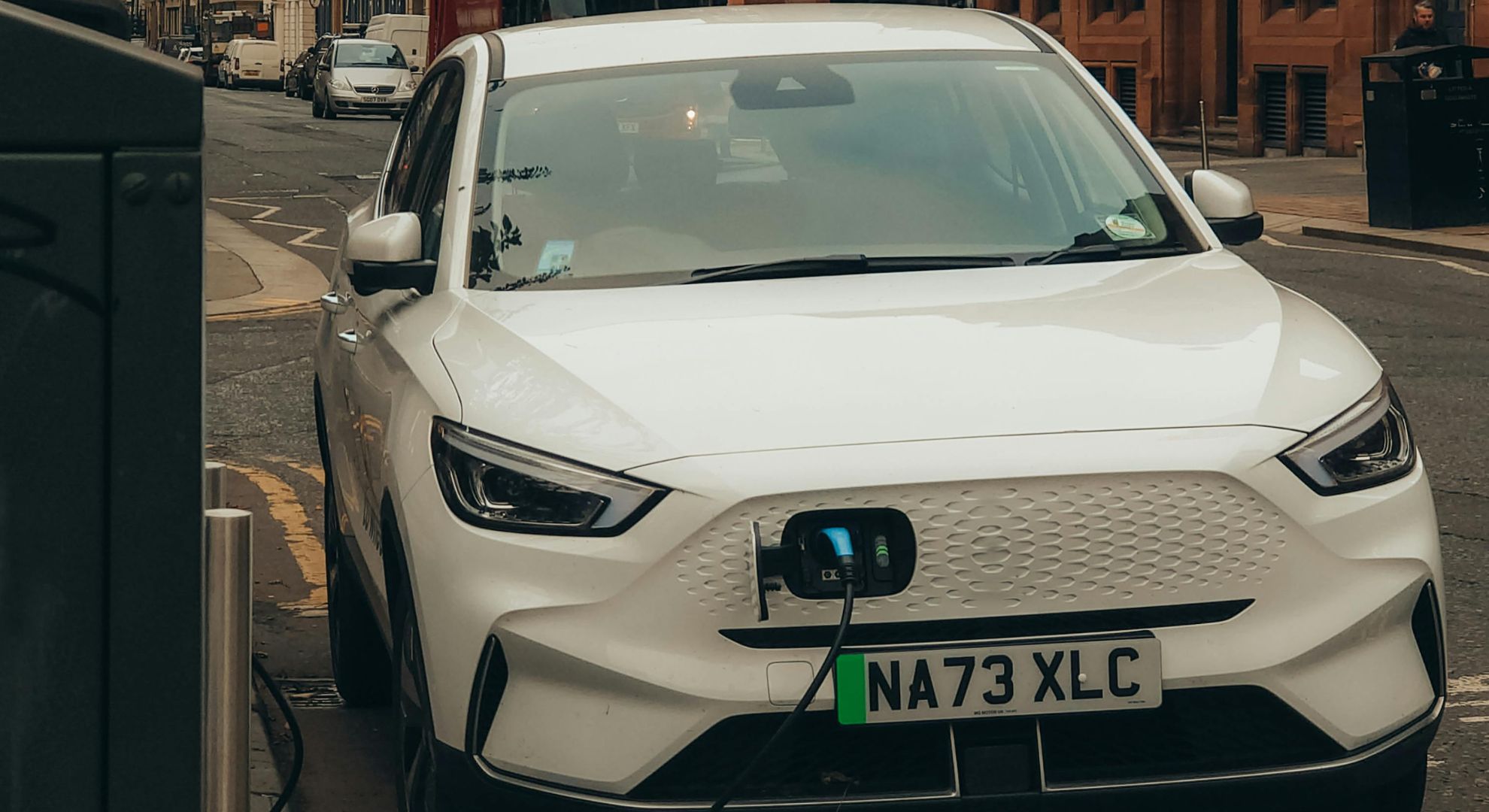 White MG EV on charge